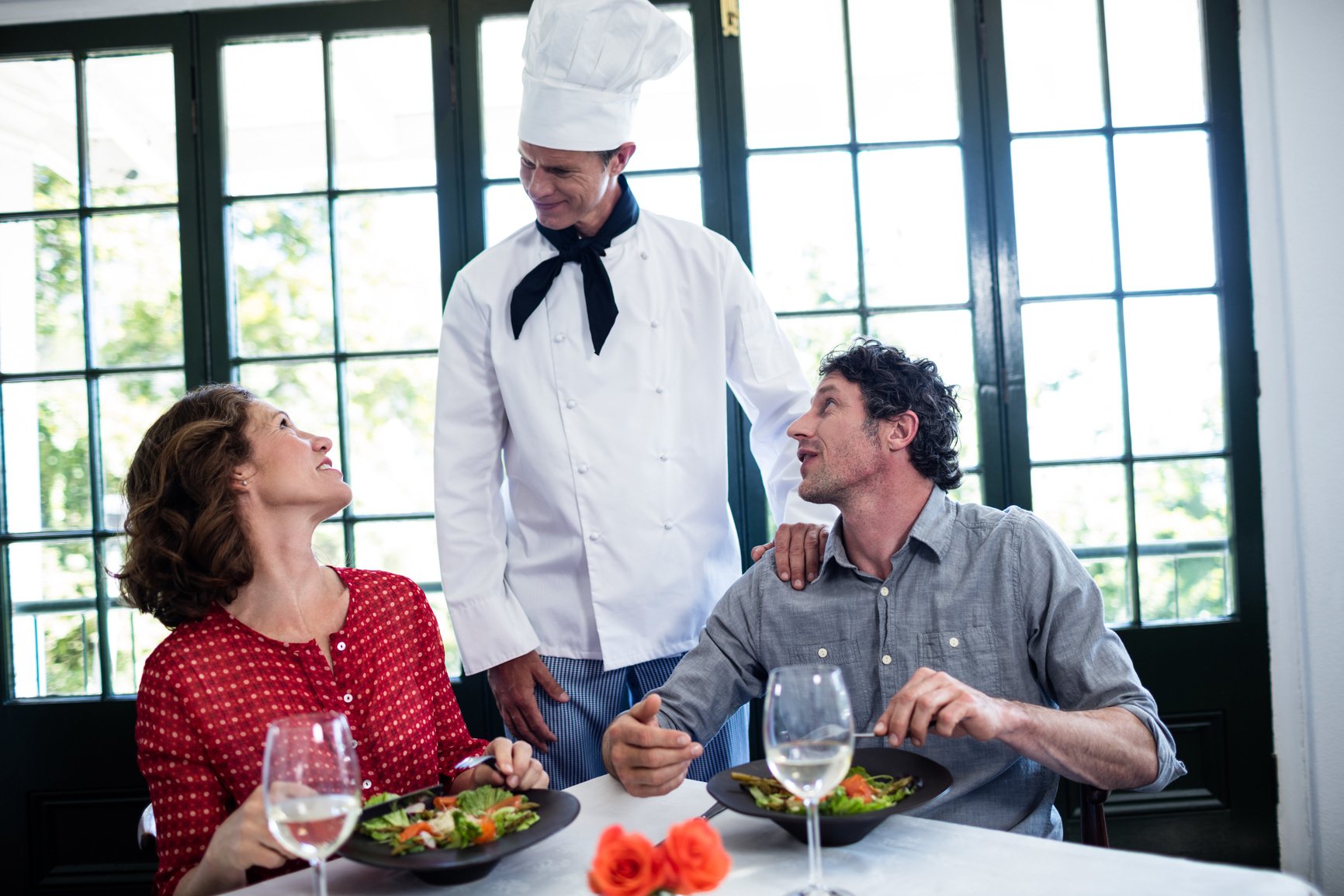 Chef talking to couple